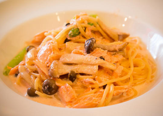Pasta with salmon, asparagus, white sauce, and fish eggs
