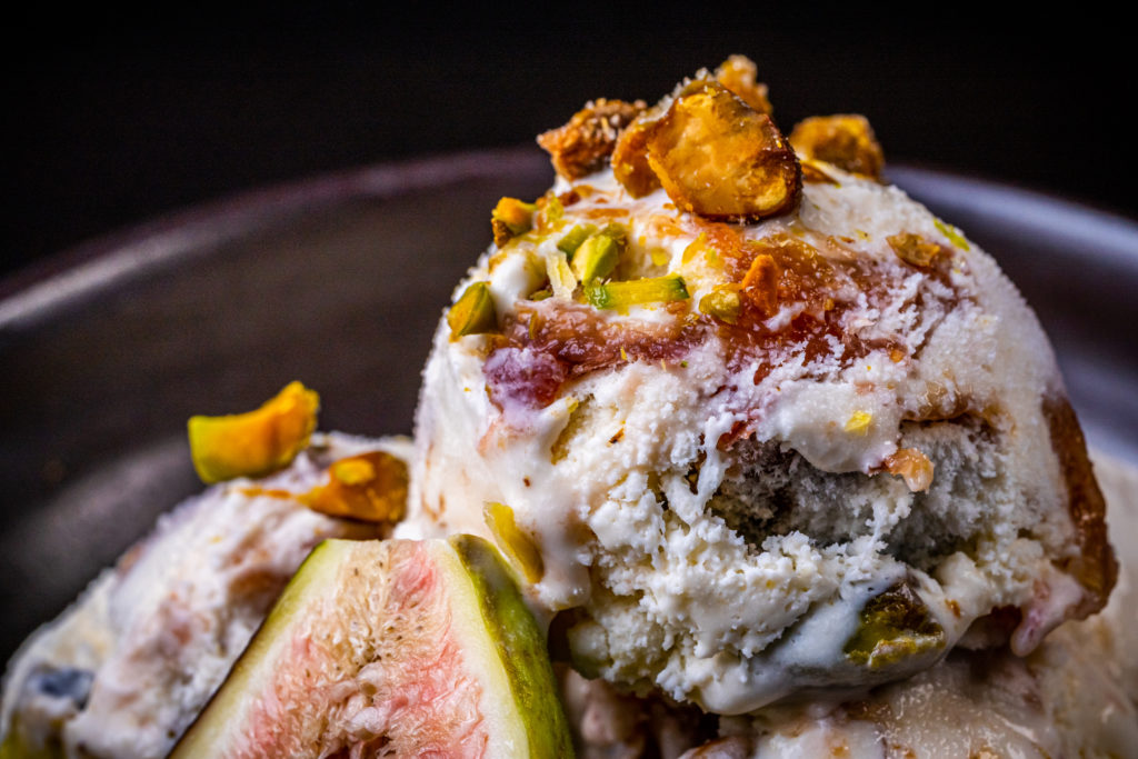 fig ice cream topped with pistachios