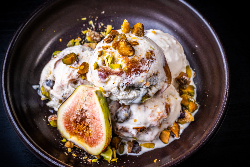 fig ice cream topped with pistachios