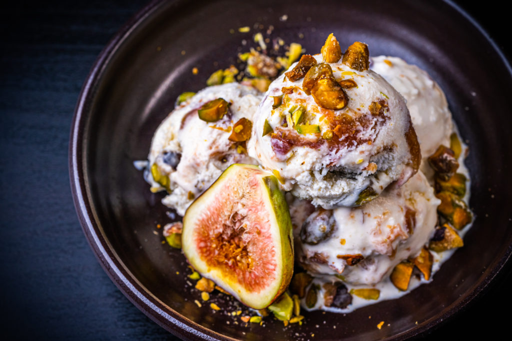 fig ice cream topped with pistachios