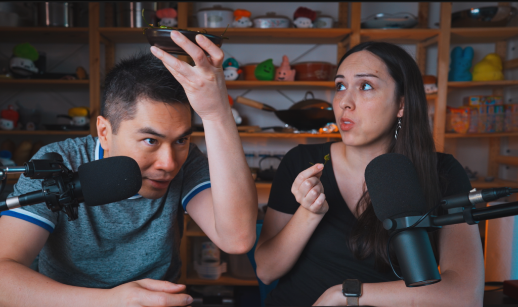 Son putting the bowl on top of his head and Allison looking worried