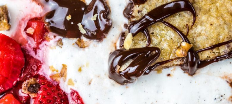 cookie with ice cream, fudge sauce, macerated strawberries