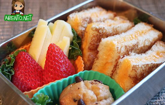 Grilled cheese triangles bento (closeup).