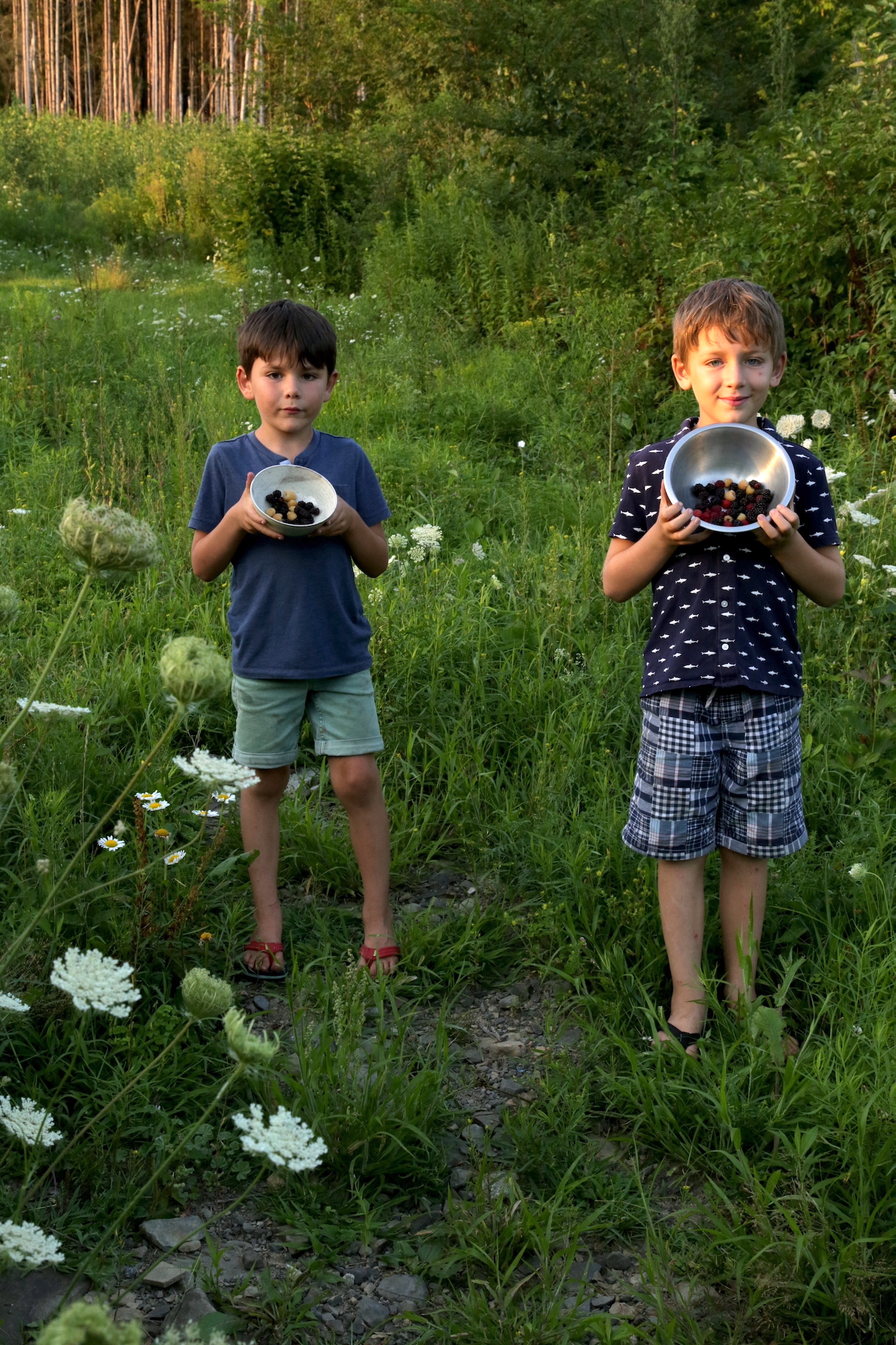 Dax and Gavin holding berries