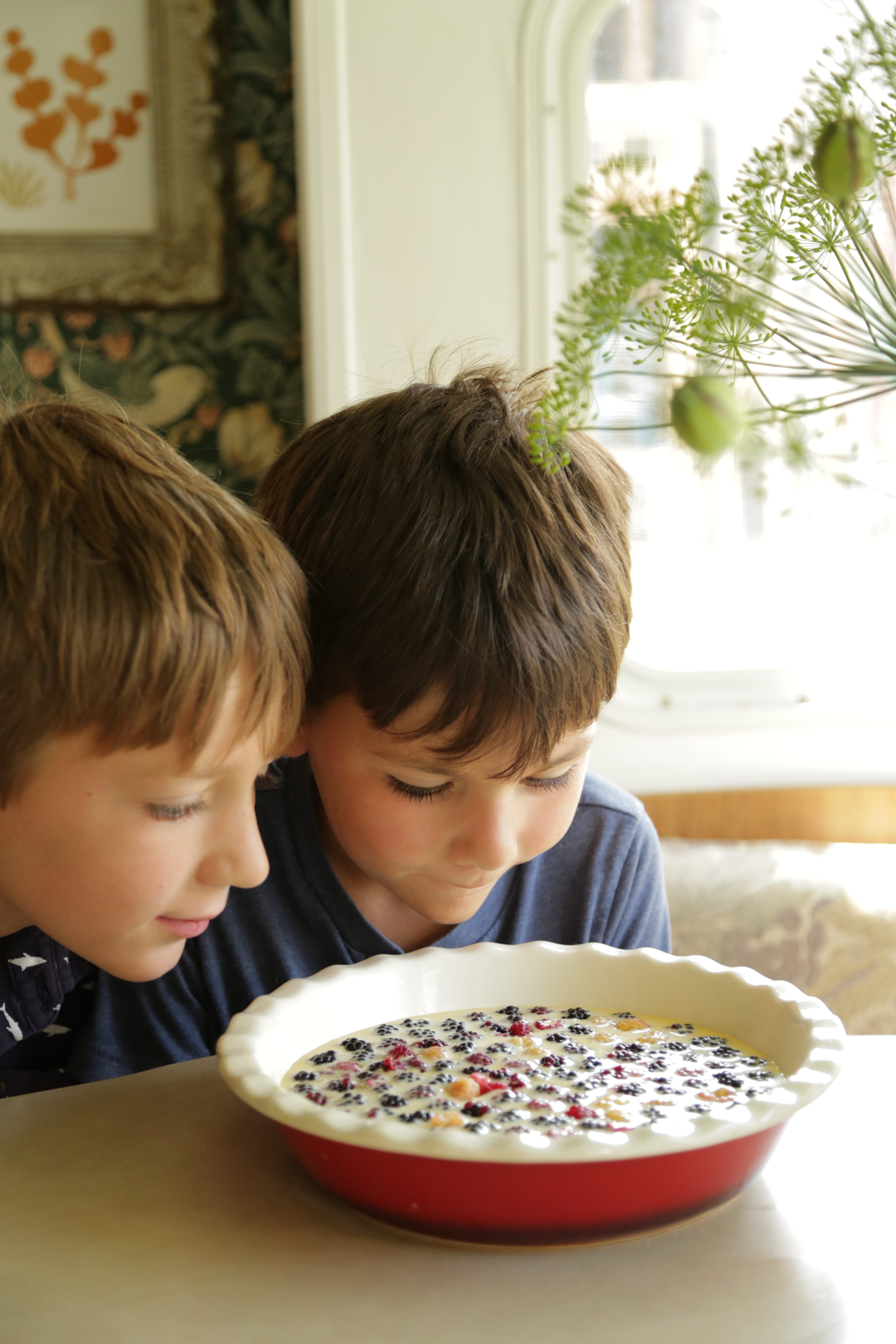 Excited kids preparing clafoutis